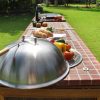 Outdoor kitchen Scandinavian design with mosaic ceramis tile top