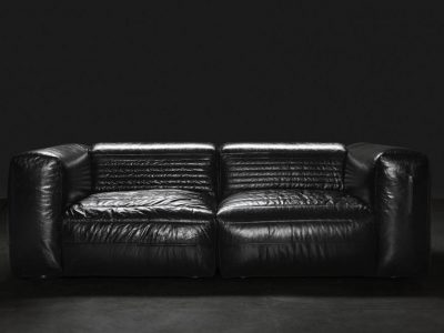 Haute couture sofa in shiny black leather