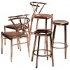 Set of Scandinavian design bar stool and chairs in copper and leather