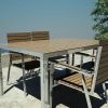 Designer table and chairs in teak and stainless steel