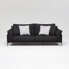 Dark grey fabric luxury sofa with white pillows