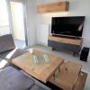 Designer coffee table with adjustable table top in solid oak